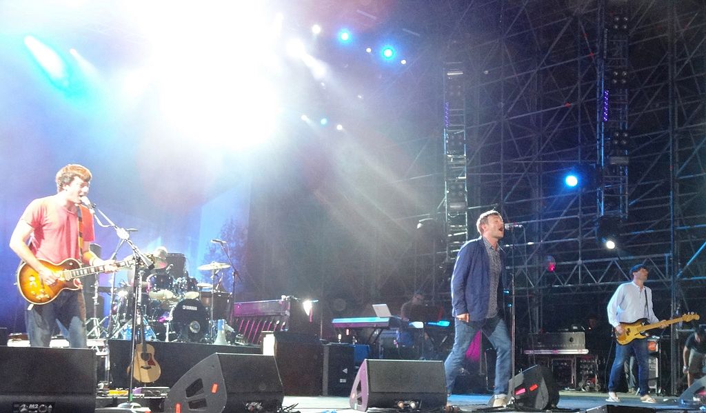 A photo of the English rock band Blur playing on stage