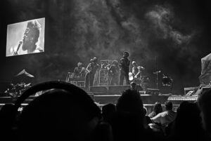 The musicians Young Fathers on stage at Climate Pledge Arena, in Seattle.